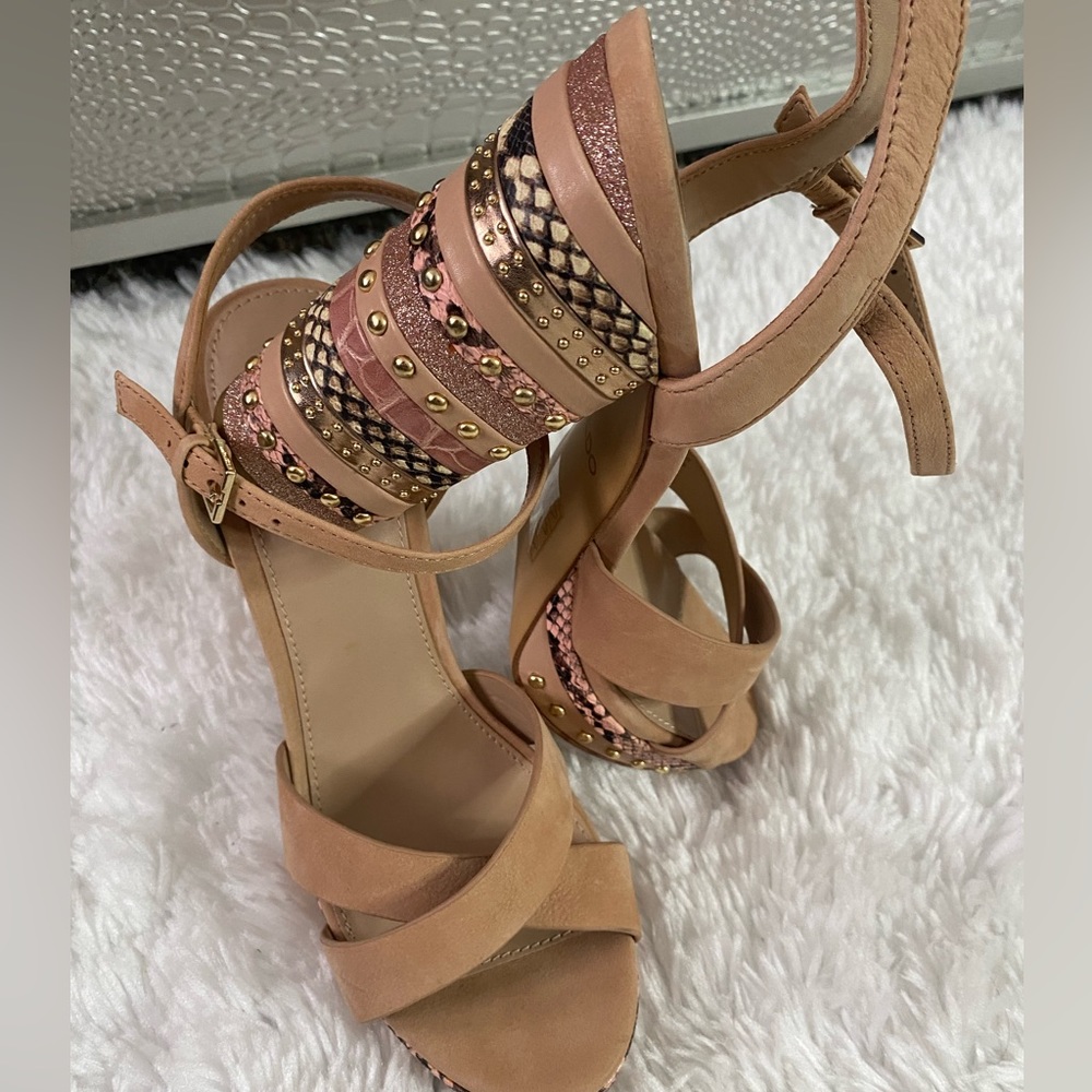 Beige block heeled sandals.